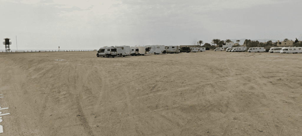 Beach and parking lot by the sea in Palomares